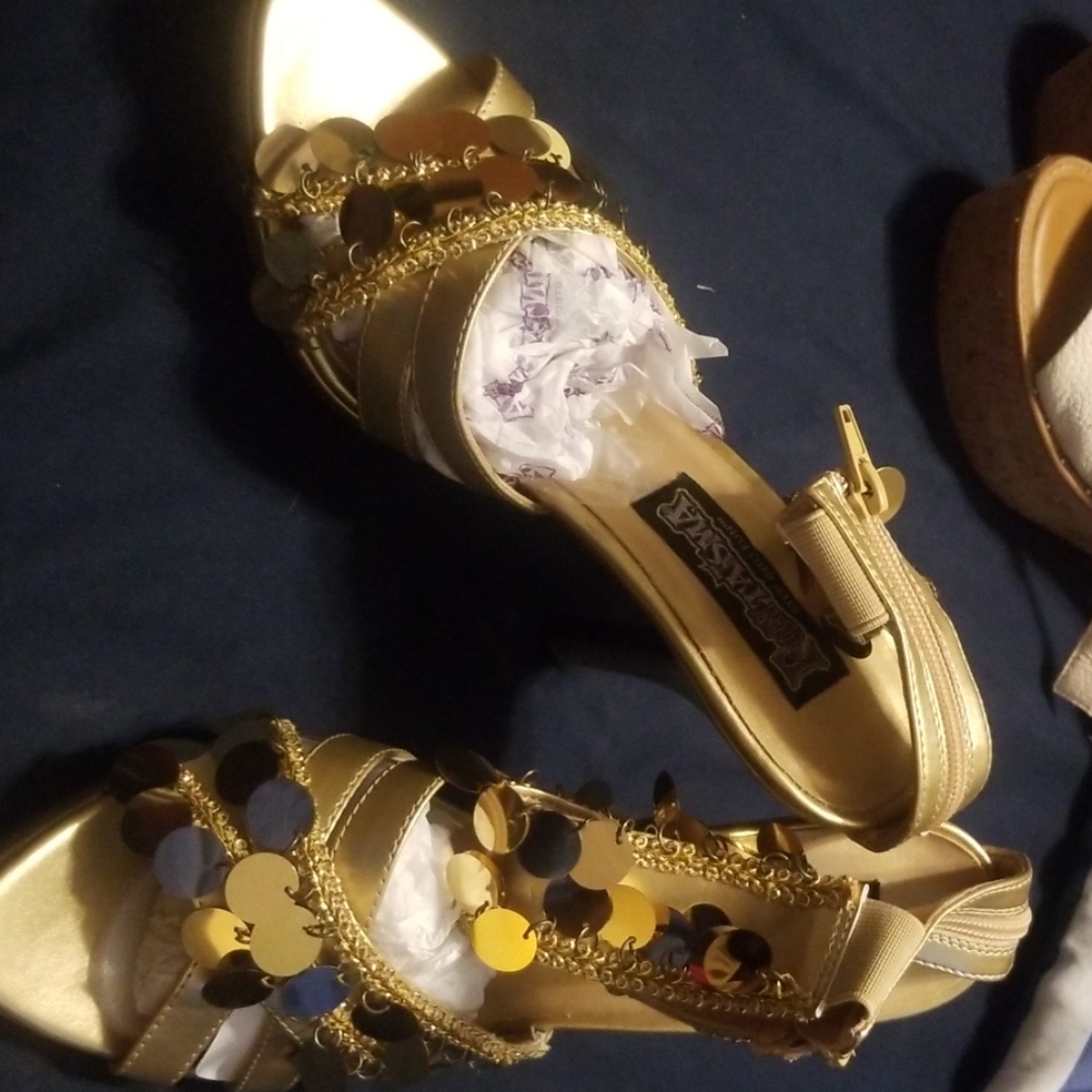 Gold ankle strap heels.